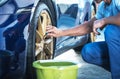 Men Detailing His Exotic Car Alloy Wheels Royalty Free Stock Photo