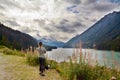 Woman and her Boston Terrier Dog visit River Valley in Pemberton Valley and Duffy Lake Road near Whistler, BC Canada as the Autumn