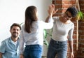 Friends giving high five greeting each other