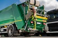 Caucasian Modern Garbage Truck Worker and the Vehicle Royalty Free Stock Photo