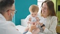 Caucasian mother with baby on a doctor appointment at clinic Royalty Free Stock Photo
