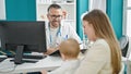 Caucasian mother with baby on a doctor appointment at clinic Royalty Free Stock Photo