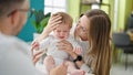 Caucasian mother with baby on a doctor appointment at clinic Royalty Free Stock Photo