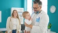 Caucasian mother with baby on a doctor appointment at clinic Royalty Free Stock Photo