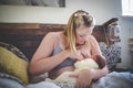 Caucasian mother breastfeeding her newborn baby at home Royalty Free Stock Photo