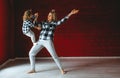 Caucasian mother and daughter doing acrobatics exercises. Little girl balancing on legs of mother Royalty Free Stock Photo