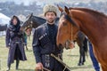 Caucasian mountaineer in national costume with his horse.