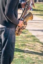 Caucasian musician entertaining people for money in park. Royalty Free Stock Photo