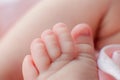 Caucasian Newborn baby foot closeup macro detail shot. child portrait, health skin, tenderness, maternity and babyhood concept - Royalty Free Stock Photo