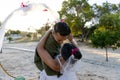 Caucasian newlywed couple dancing at wedding ceremony at beach during sunset Royalty Free Stock Photo