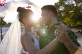 Caucasian newlywed young couple dancing romantically at beach at wedding ceremony during sunset Royalty Free Stock Photo