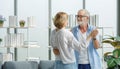 Caucasian old senior elderly happy grandparents lover married couple standing smiling look at each other face listening to slow Royalty Free Stock Photo