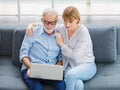 Caucasian old senior elderly lovely lover grandparents romantic couple gray hair and bearded husband and wife sitting smiling