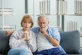 Caucasian old senior grandparents couple in casual wear gray bearded and hair grandpa husband and grandma wife sitting stress Royalty Free Stock Photo