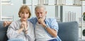 Caucasian old senior grandparents couple in casual wear gray bearded and hair grandpa husband and grandma wife sitting stress Royalty Free Stock Photo