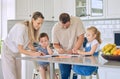 Caucasian parents helping children with homework. Two siblings doing school work. Mother helping her son with homework Royalty Free Stock Photo