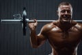 Caucasian man pumping up muscles. fitness training