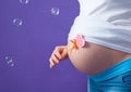 Caucasian pregnant woman stress anxious with butterfly in the stomach isolated studio on gray background Royalty Free Stock Photo