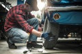 Professional Classic Cars Restoration Worker and His Garage Project Royalty Free Stock Photo