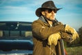 Caucasian Rancher Wearing Cowboy Hat and Sunglasses Royalty Free Stock Photo