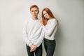 Caucasian red haired brother and sister isolated over white background