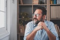 Caucasian reflexive looking at laptop screen, reflexing on work, businessman independent working in a difficult project. Male Royalty Free Stock Photo