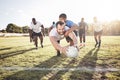 Caucasian rugby player diving to score a try during a rugby match outside on a field. Young male athlete making a dive Royalty Free Stock Photo