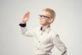 Caucasian schoolboy with his hand raised ready to answer a question. Royalty Free Stock Photo