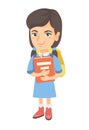 Caucasian schoolgirl with backpack and textbook.