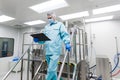 Scientist stand on metal stairs in laboratory