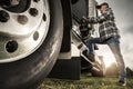 Caucasian Semi Truck Driver Getting Inside To His Tractor Cabin Royalty Free Stock Photo