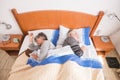 Caucasian senior adult aged couple sleeping in the morning at home in the bedroom. dovided one side each like not friendly Royalty Free Stock Photo