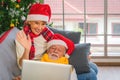 Senior couple having video call with family on laptop during Christmas eve Royalty Free Stock Photo