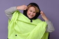 Caucasian senior woman wearing a green raincoat Royalty Free Stock Photo