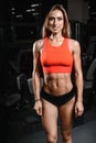 Caucasian fitness female model in gym close up abs Royalty Free Stock Photo