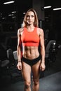 Caucasian fitness female model in gym close up abs Royalty Free Stock Photo