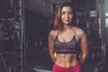 Caucasian fitness female model in gym close up abs Royalty Free Stock Photo