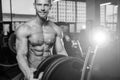 Caucasian fitness male model execute exercise with barbell Royalty Free Stock Photo