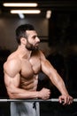 Caucasian fitness male model execute exercise with barbell Royalty Free Stock Photo