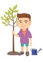 Caucasian smiling boy planting a tree. Royalty Free Stock Photo