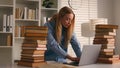 Caucasian student girl high school female university leaner woman studying with laptop and books write homework writing