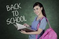 Caucasian student with text of back to school Royalty Free Stock Photo