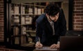 Caucasian successful professional diligent bearded and mustache male businessman in formal suit sitting at work desk typing laptop Royalty Free Stock Photo