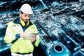 Caucasian technician engineer man using tablet checking the system on chemical refinery factory and building glowing in the night Royalty Free Stock Photo