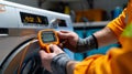 Caucasian technician using multimeter to test washing machine functionality in workshop. concept of appliance repair