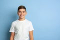 Caucasian teen`s portrait isolated on blue studio background Royalty Free Stock Photo