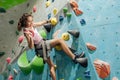 Caucasian teenage girl playing and climbing rock mountain with amusement for adventure and sport. Activity and Education Concept Royalty Free Stock Photo