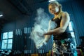 Caucasian teenage girl practicing in weightlifting in gym