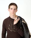 Caucasian teenage holding leather jacket Royalty Free Stock Photo