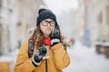 Outdoors winter portrait of beautiful teenage girl speaking on the phone Royalty Free Stock Photo
